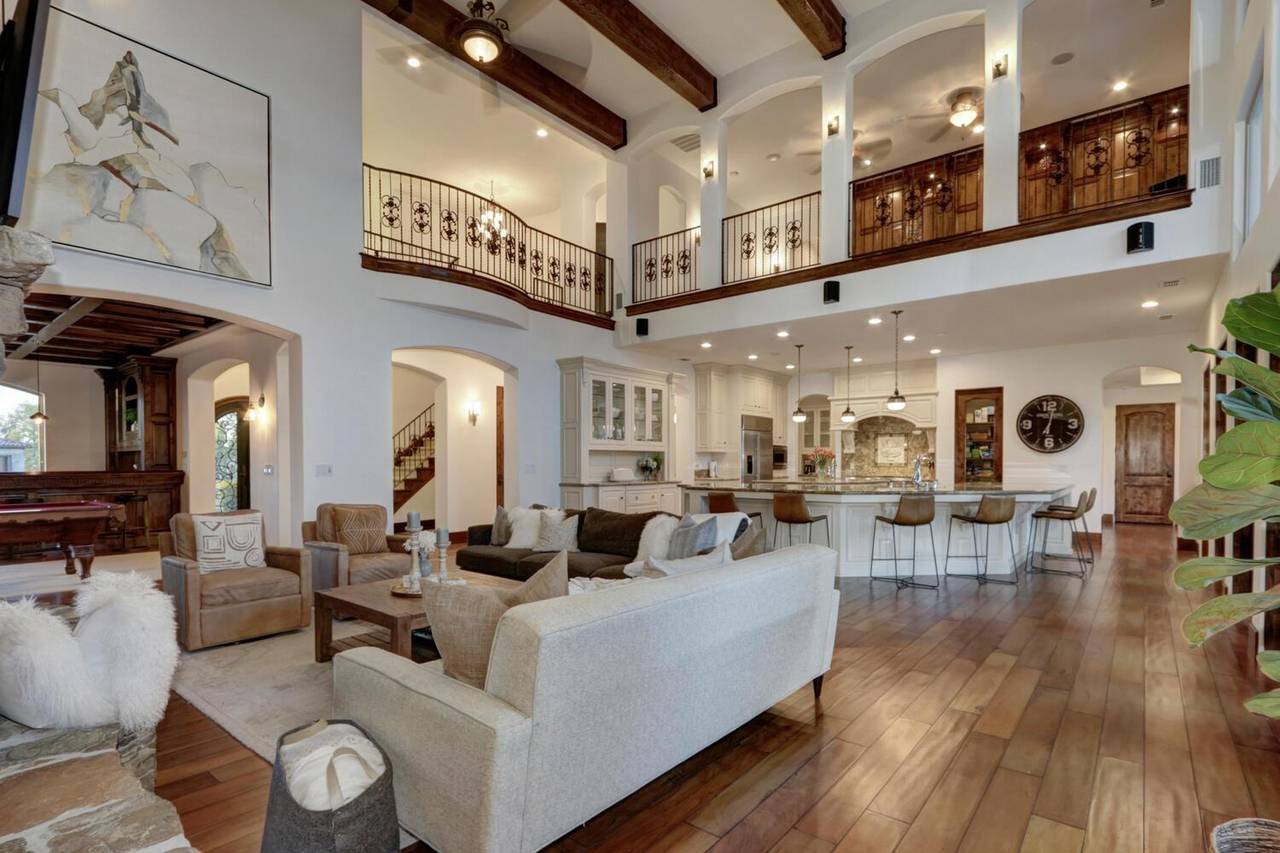The great room, with exposed beams and a balcony above