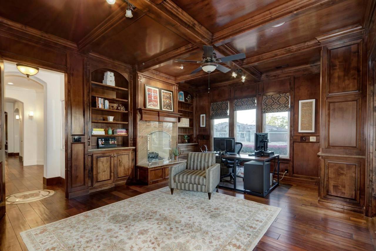 The study, panelled in wood with built-in bookshelves