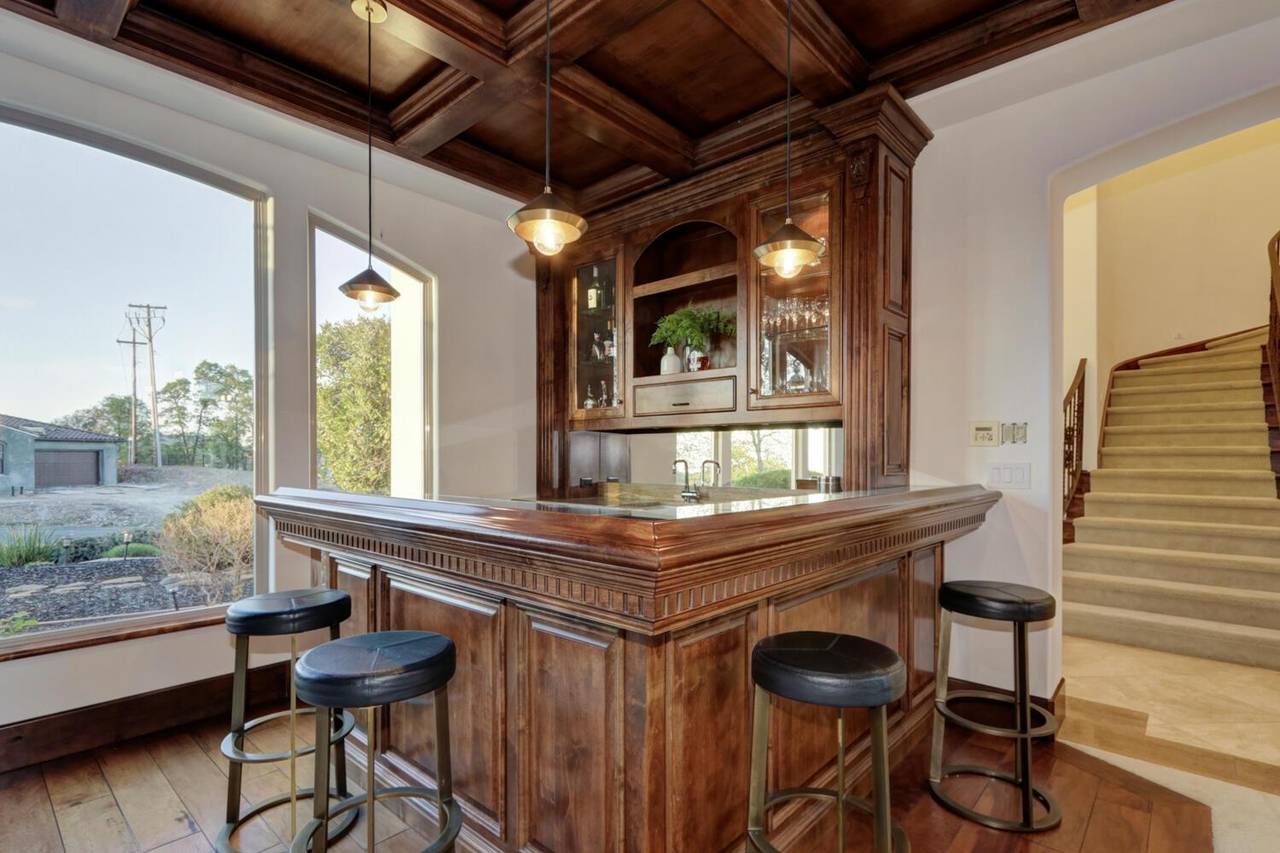 The bar, in timber with stools along it
